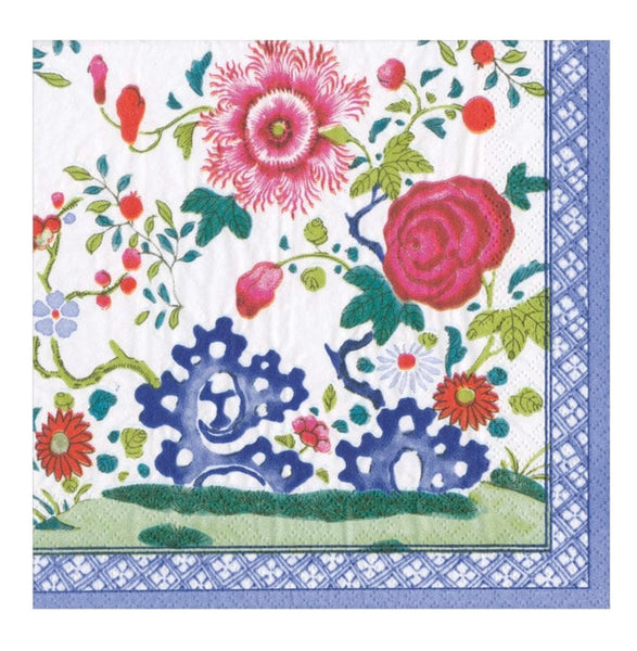 A colorful floral pattern on a 5" x 5" Caspari Cocktail Napkin with a decorative blue border.