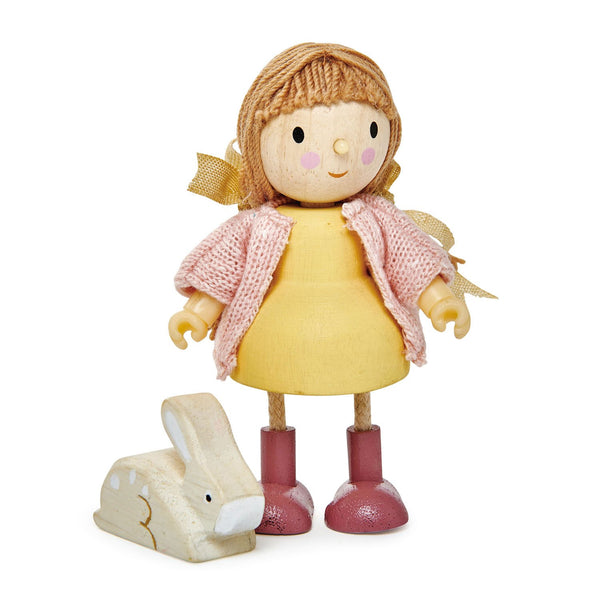 A small Tenderleaf Amy & Her Rabbit doll with a yellow dress, pink scarf, and red boots, standing next to a white bunny toy, isolated on a white background.