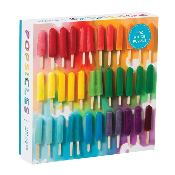 The Rainbow Popsicles 500 Piece Puzzle by Chronicle Books is a fun, colorful puzzle that features an assortment of vibrant popsicles arranged in rows on the box cover, with the word "Popsicles" displayed on the left side of the box.