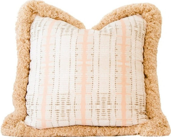 The Backbone Petal Pillow from Associated Design is a handmade pillow showcasing a beige and white patterned fabric center, accented by a thick, textured brown border. Measuring 22" x 22", this custom down-filled pillow brings an elegant touch to any room.