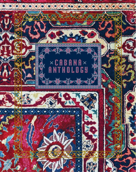 The Vendome "Cabana Anthology" book sits on a colorful, ornate rug with intricate patterns and floral motifs framed by a yellow border, exemplifying a luxurious lifestyle and impeccable interior design.