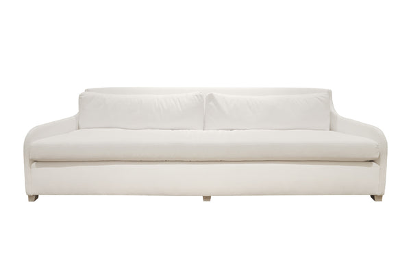 Introducing the Sophie Sofa by Verellen: a white, modern three-seater with two large seat cushions and a low, curved backrest. This bench-crafted piece promises both style and comfort with its Perennials Old Hand Blanca fabric.