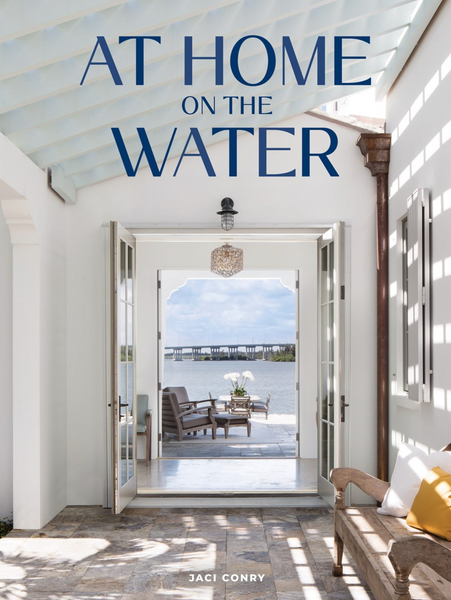 Serene oceanside At Home on the Water entrance with open doors leading to a pier by Common Ground.