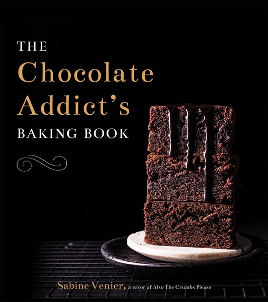 Book cover of the "Chocolate Addict's Baking Book" by Common Ground, featuring a stack of four chocolate brownies with dripping chocolate on a white plate against a dark background, showcasing irresistible chocolate recipes and creative treats for every baking enthusiast.