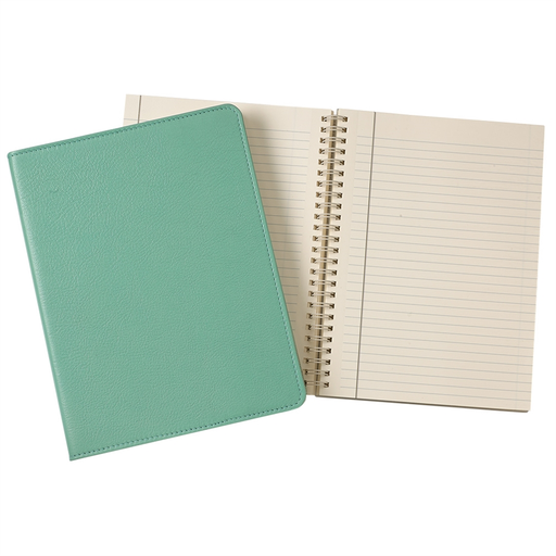 A closed Robins Egg Blue leather wire-bound notebook by Graphic Image rests beside an open spiral-bound notebook with lined pages, the latter featuring premium paper.