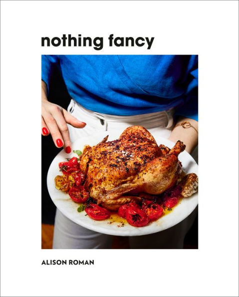 A person in a blue shirt holds a plate with roasted chicken and tomatoes. The text on the image reads "Nothing Fancy: The Art of Having People Over" by Common Ground, highlighting laid-back recipes for an impromptu dinner idea.