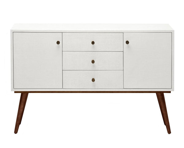 The Mara Buffet Pristine Raffia by Made Goods is a vintage-inspired, white mid-century modern sideboard featuring three central drawers, two side cabinets, wooden legs, and textured faux-raffia details—perfect for dining room storage.