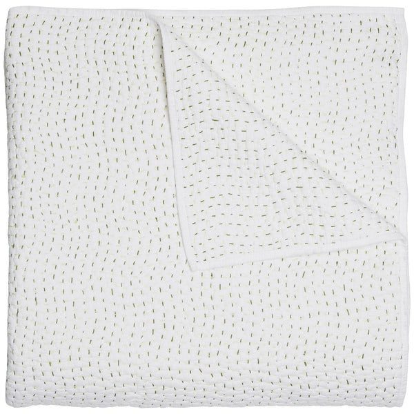 A folded John Robshaw Hand Stitched Coverlet in Moss, featuring a simple dotted pattern in light green on a pristine white background. One corner is flipped over, showcasing the charming pattern on the underside. This lightweight and warm coverlet is crafted from organic cotton voile and expertly hand-stitched by John Robshaw for added charm.