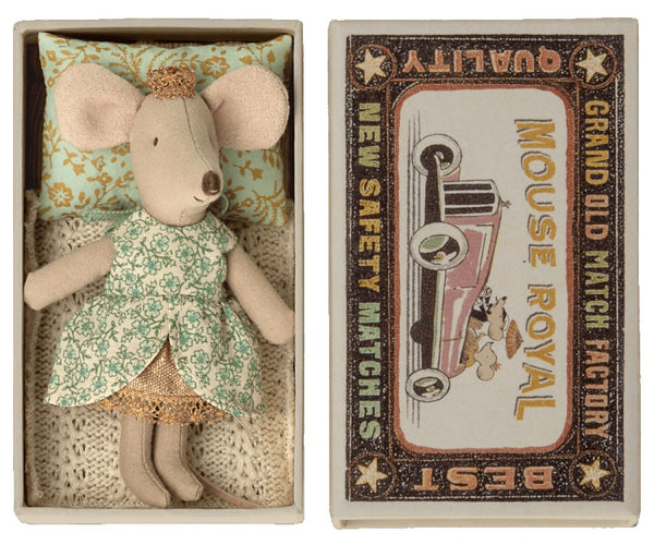 Maileg's Princess Little Sister Mouse in Box - Mint features a mouse dressed in a floral patterned outfit resting in a matchbox labeled "Mouse Royal," adorned with a vintage car illustration on the cover and topped with a tiny golden tiara.