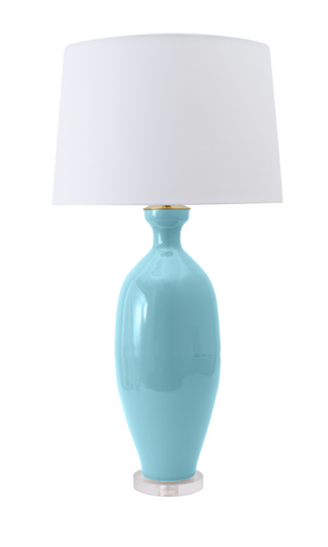 The Paul Schneider Elizabeth Lamp in Sky Blue with a white fabric shade on a silver base from Paul Schneider Ceramics.