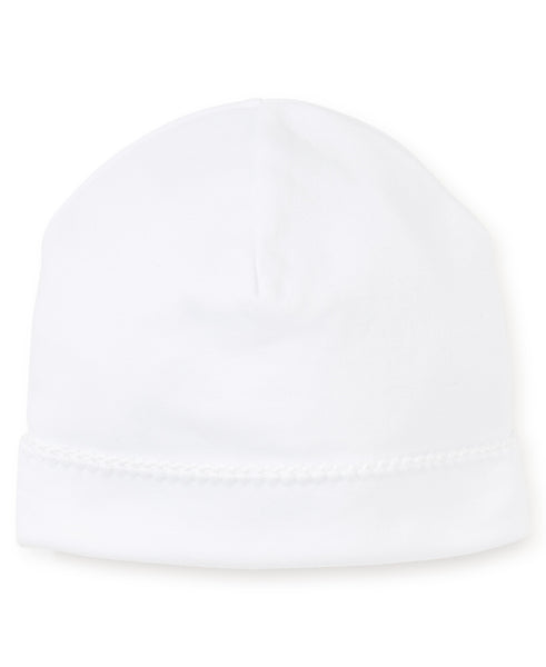 The Kissy Kissy Premier Basics Hat is a plain white beanie with a folded brim and visible stitching along the edge, crafted from 100% Pima cotton to keep your baby's head warm. This cozy hat from Kissy Kissy ensures both comfort and style.